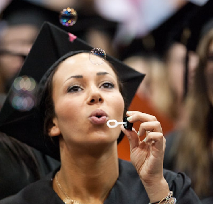 graduate blowing bubbles