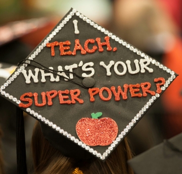 graduation cap decorated with words I teach what's your superpower