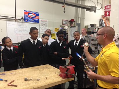 Dale Pearce talking with students