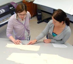 Two students looking at a piece of paper